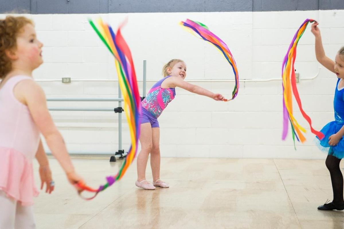 Three girls twirl ribbons during the Pre-K Moves class on Thursday, Feb. 1, at ABCDance in Bellingham. ABCDance offers a variety of classes for children and adults.