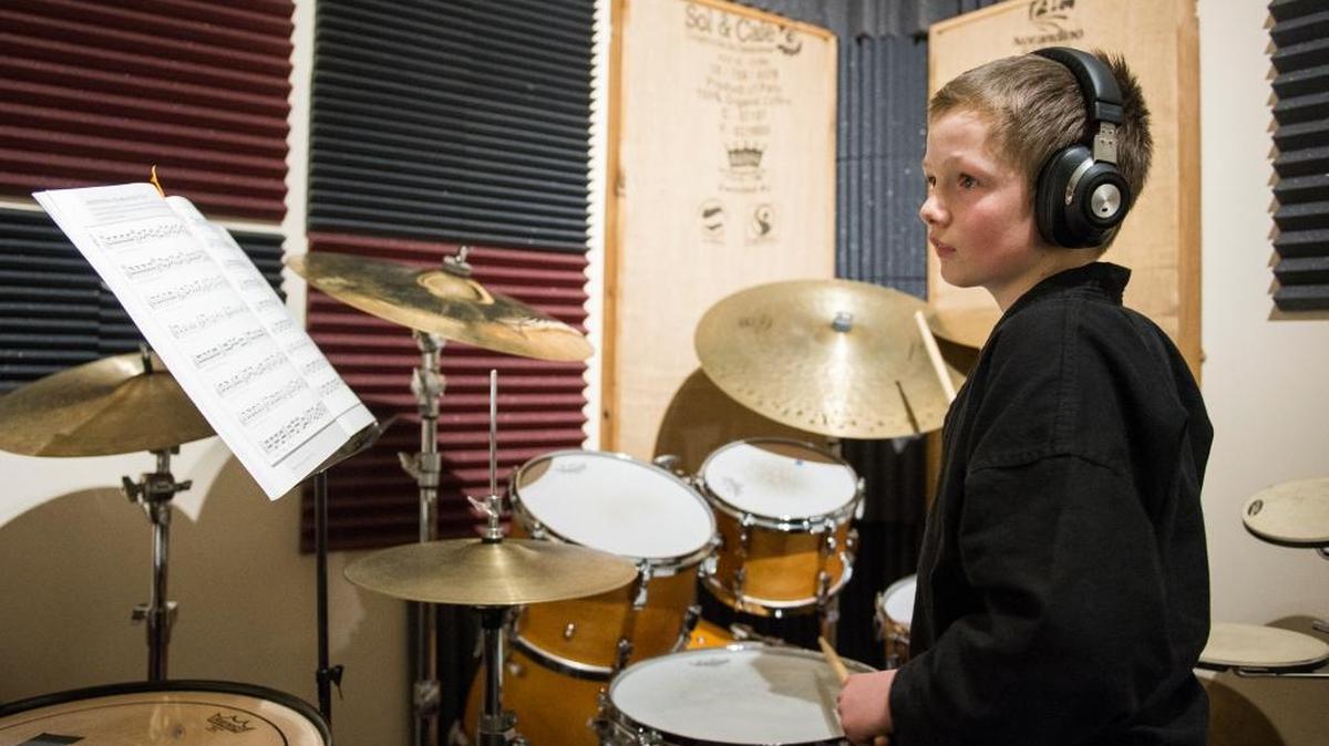 Kiran Wolfe plays drums during a lesson at Bellinghome School of Music Feb. 6 in Bellingham.