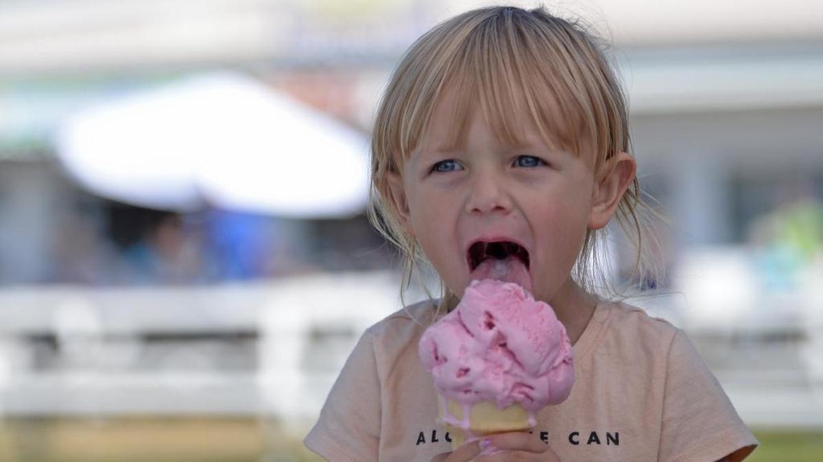 Cora Rusling 3, enjoys an strawberry ice cream cone while visiting the 2016 Northwest Washington Fair in Lynden with her mom Jenny Rusling. The Northwest Washington Fair offers six days of fun for people of all ages, especially children, including entertainment, the carnival, farm animals, the rodeo and plenty of food.