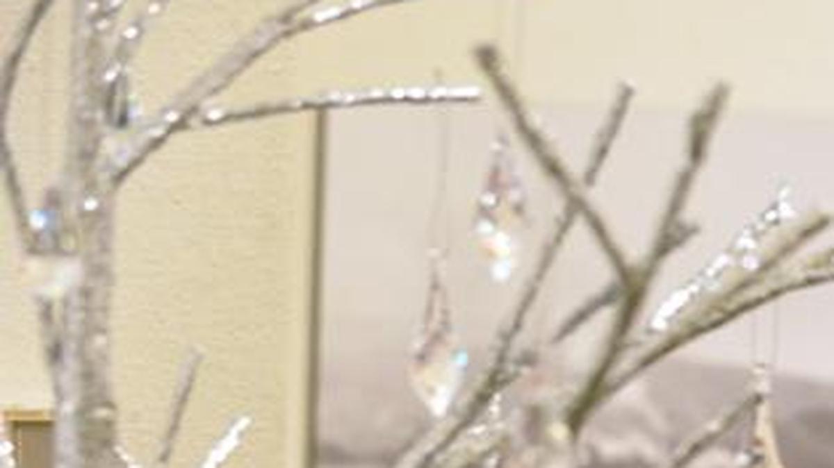 Danya VanderMey checks out a crystal and sequin tree with daughters Mariah, right, and Cora during Whatcom Museum's Deck the (Old City) Hall lighting celebration in 2013. The 2016 event runs from Nov. 25 through December.