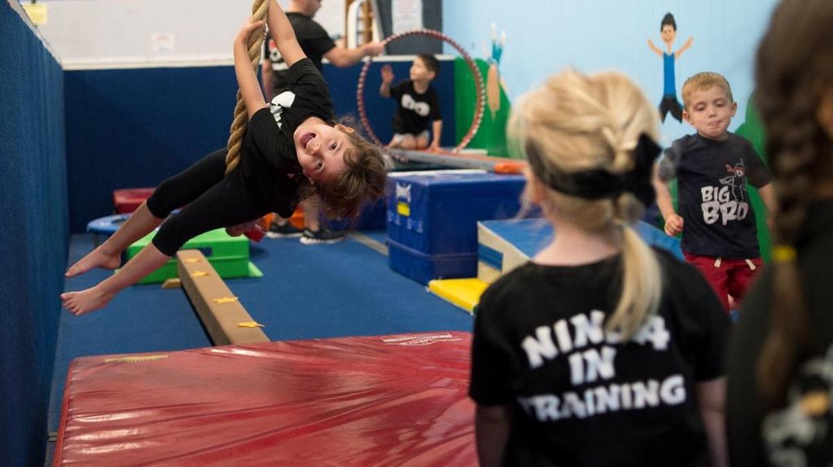 Kids go through an obstacle course during a Ninja Zone class at North Coast Gymnastics Academy on Friday, June 23, in Bellingham.