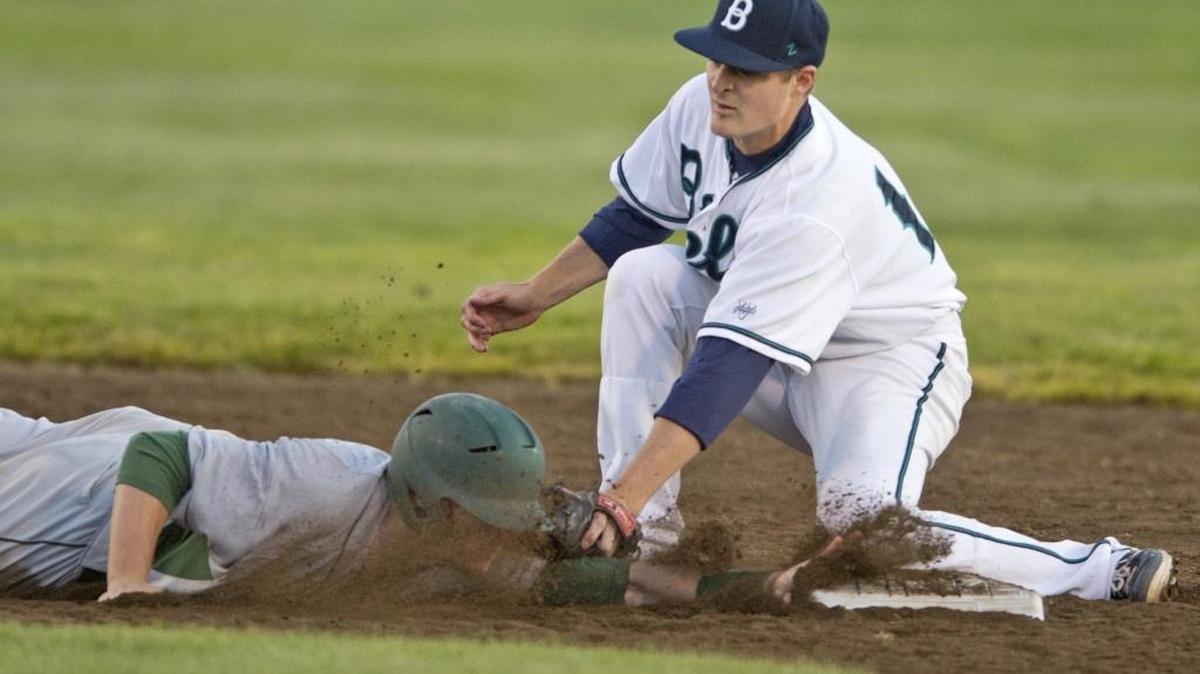 Bellingham Bells second baseman Dustin Breshears tags out a runner at second base in June 2014 at Joe Martin Field.