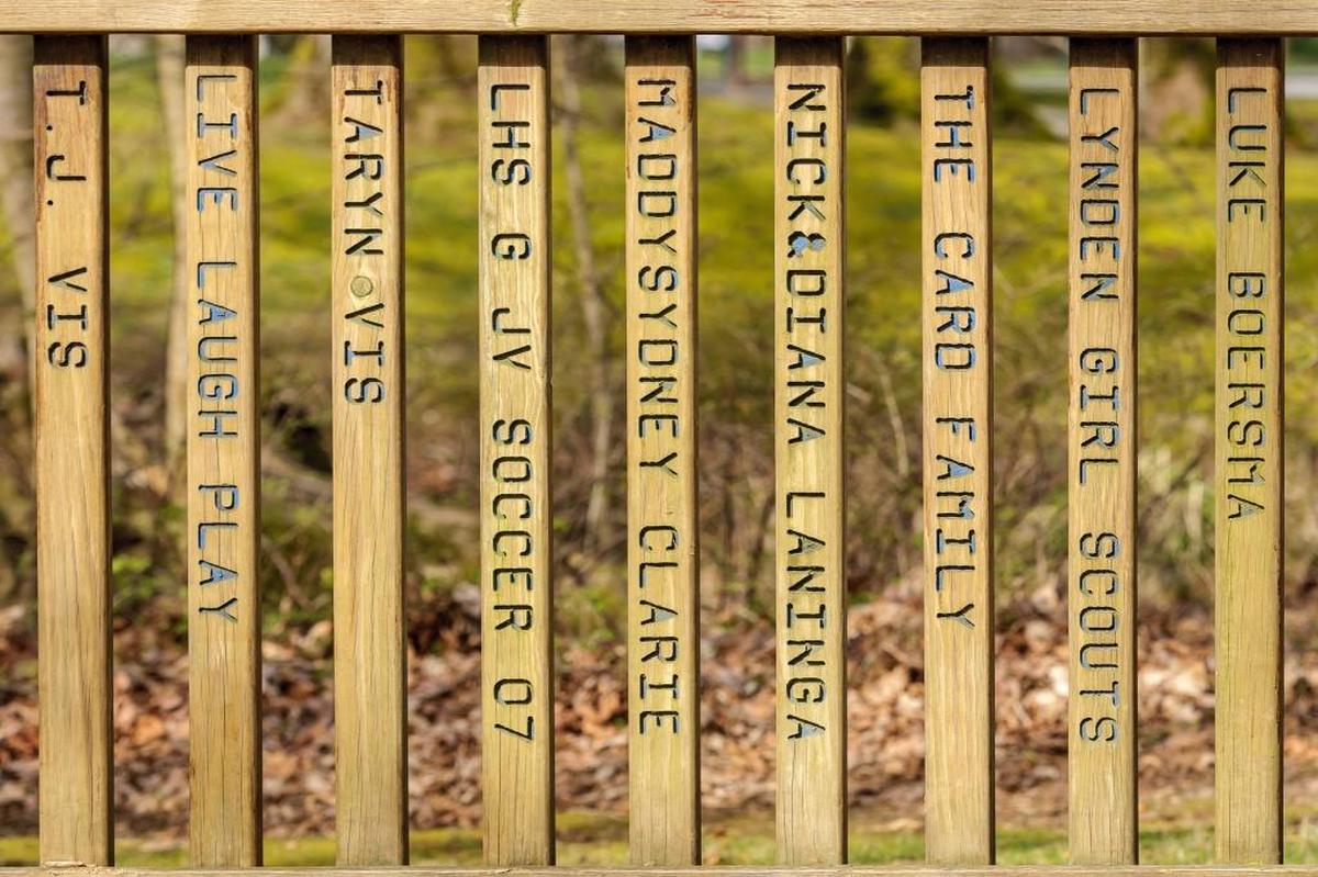 Names of local donors line the fencing around the Million Smiles Park at Lynden City Park.