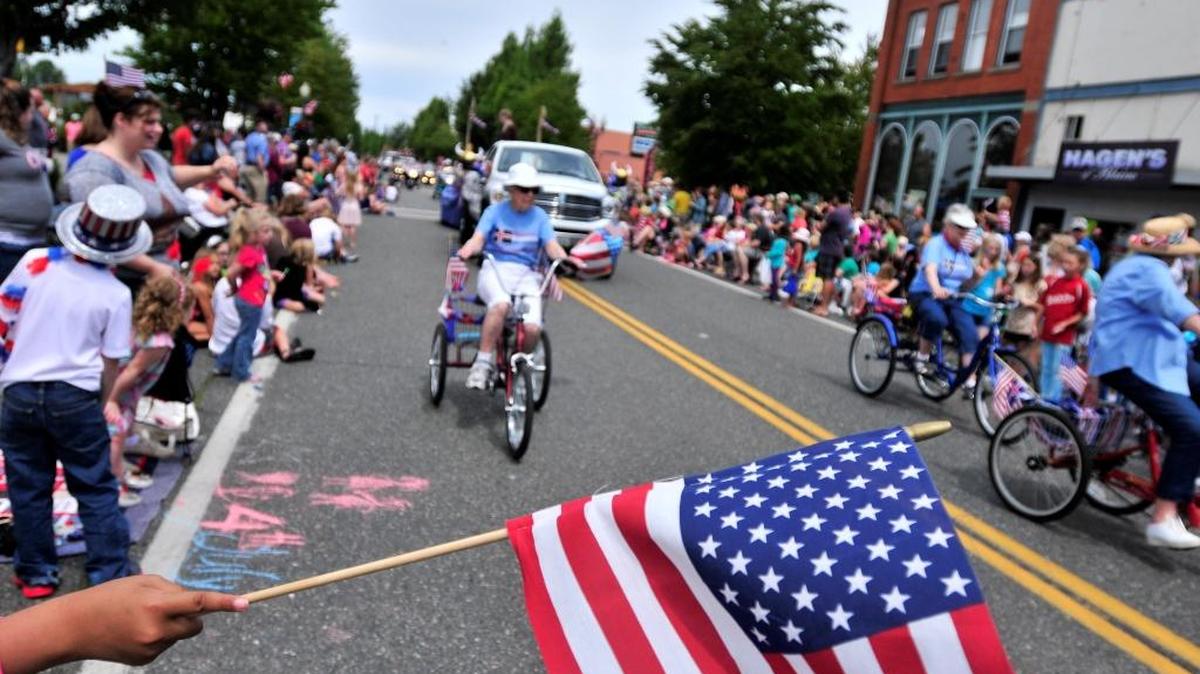 Thousands lined Peace Portal Drive to watch almost 100 entries pass by during the Old Fashioned 4th of July parade in Downtown Blaine in 2014.