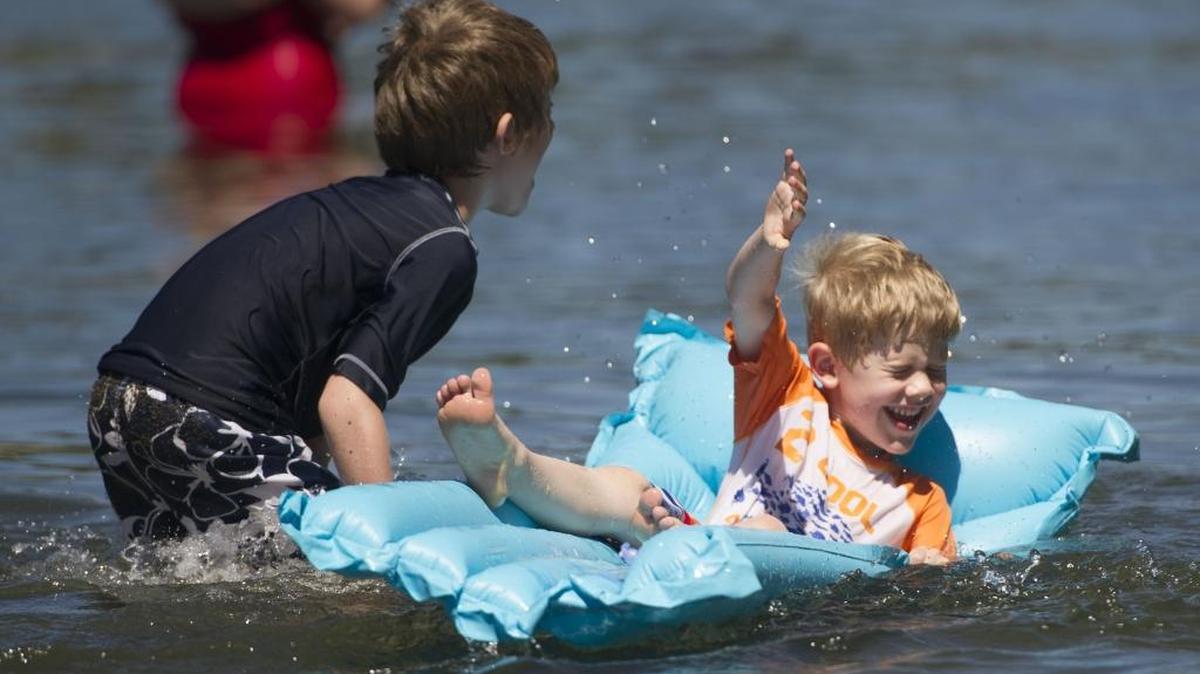 Nathan Boer, 7, splashes his brother Evan Boer, 5, while playing in Lake Whatcom at Bloedel-Donovan Park Monday, June 8, 2015.