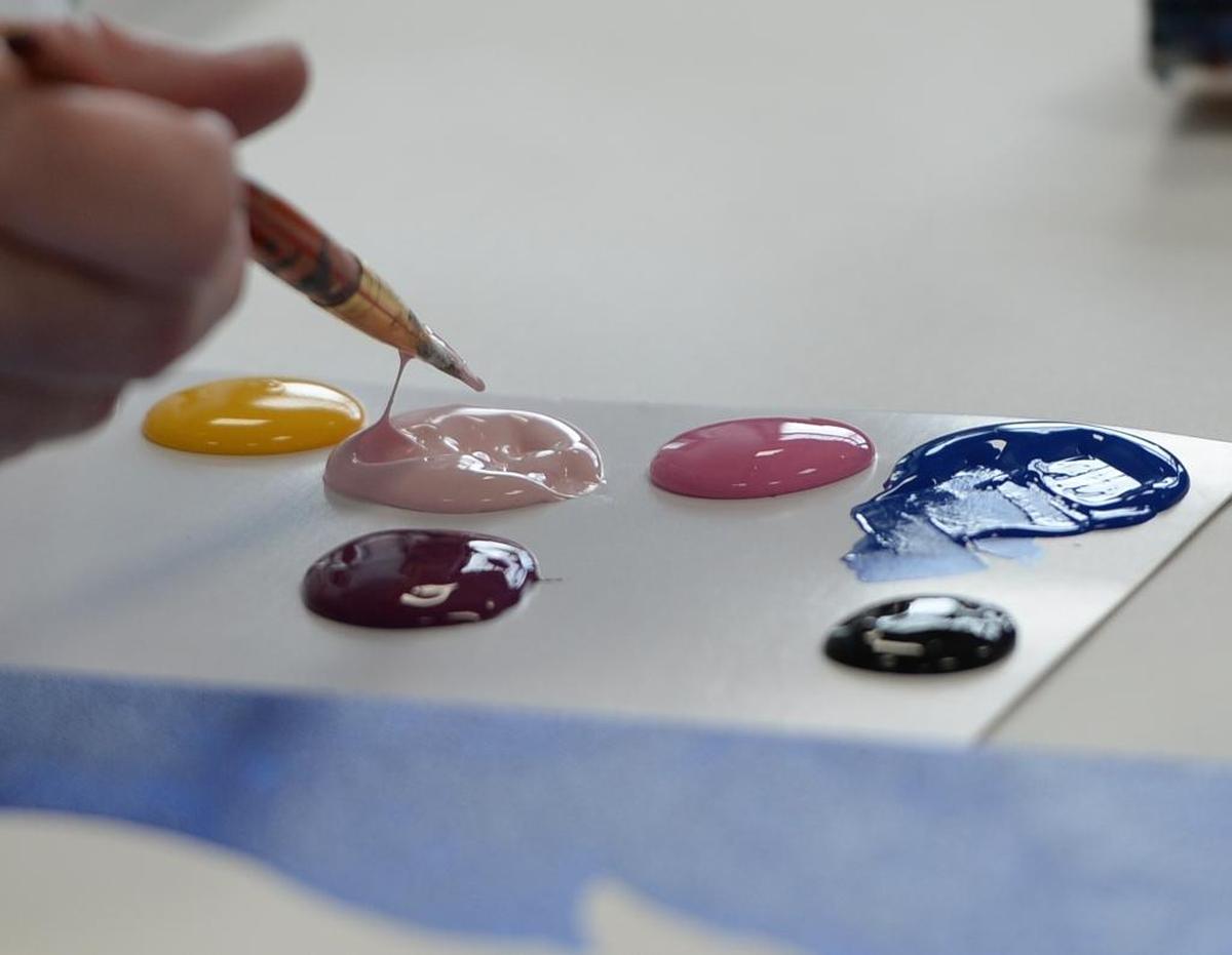 Making a painting of a unicorn at the new location of Uptown Art studio at 800 Harris Ave., #101in the Fairhaven District of Bellingham, Thursday, April 13.