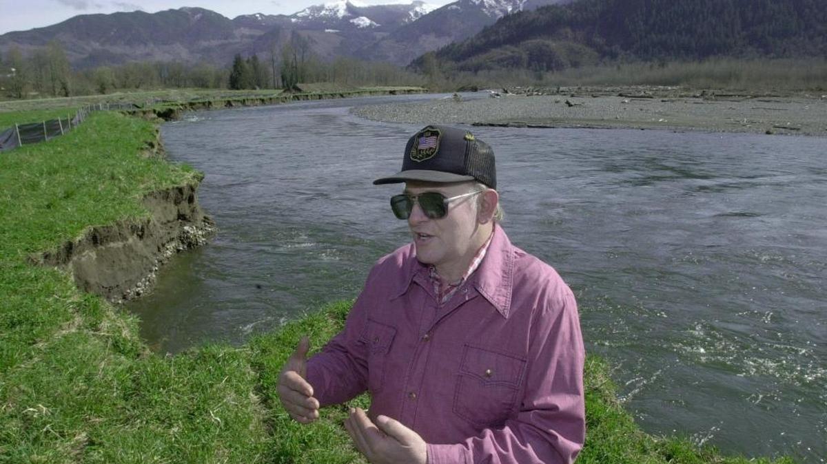Hank Rensink stands near the edge of the Nooksack River on the property he donated to the Whatcom Land Trust for transfer to Whatcom County as the Deming Homestead Eagle Park.