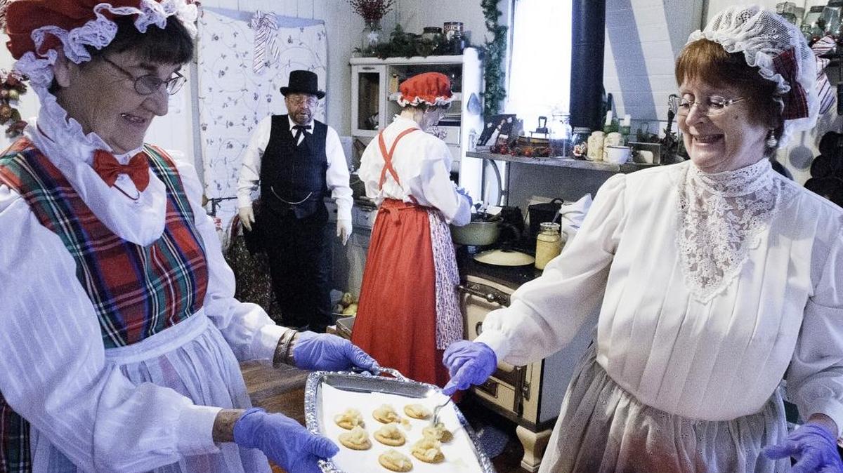 Ferndale Heritage Society members Louise Sager, left, and Cheryl Gregor, both from Ferndale, make miniature apple pies at the Shields House during the 2014 Olde-Fashioned Christmas in Pioneer Park in Ferndale.