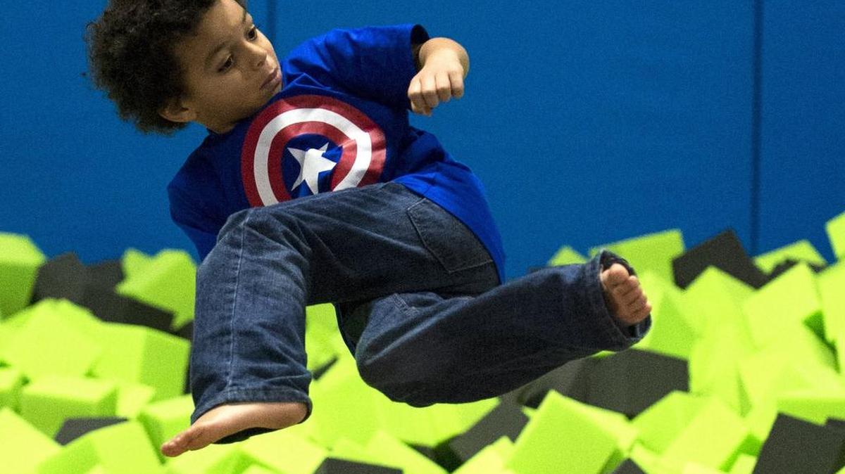 
LaDainian Webster flips into a foam pit at the Trampoline Zone in 2014.
