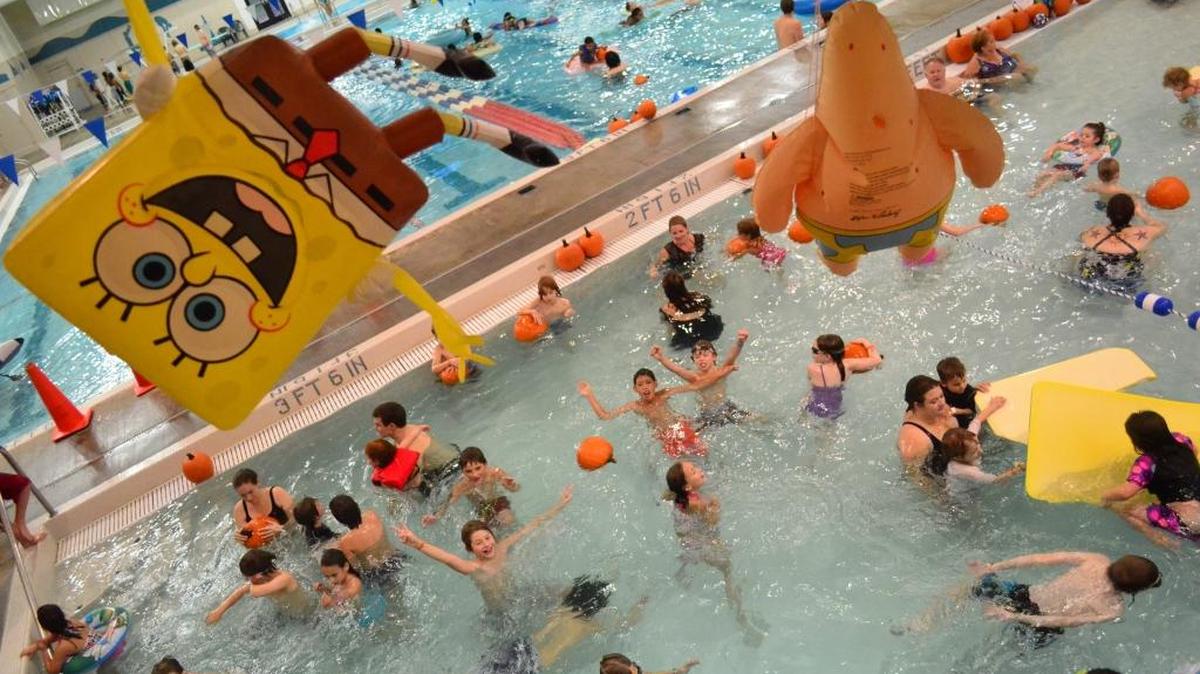 Scenes from the Arne Hanna Aquatic Center’s Pumpkin Patch in the Pool in 2013. Lifeguards threw dozens of pumpkins in to each of the pools, allowing kids to pick their favorite to gather and take home.