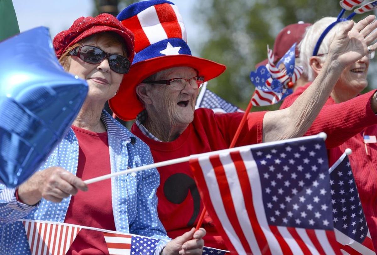 United Church of Christ members Sally Malby, left, Claudia Hogan and Joan Kempinsky wave from their float during the Blaine Independence Day parade on July 4, 2016.