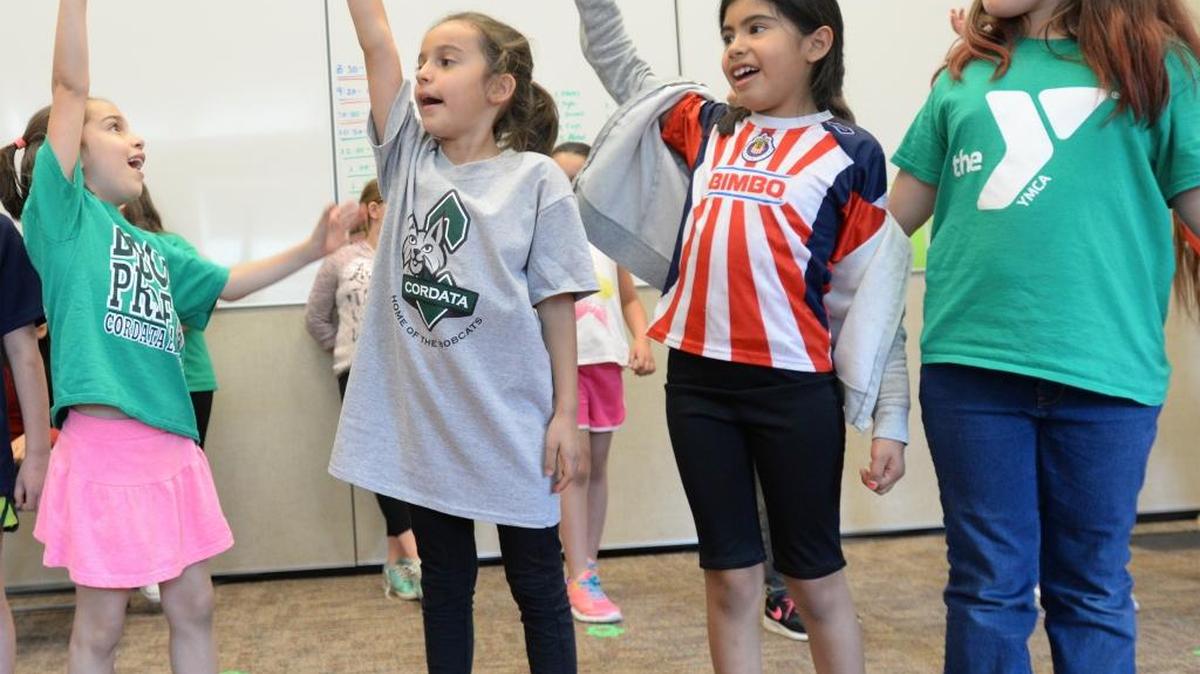 Lucia Goritsas, 8, left, her sister Gabriella Goritsas, 8, Jacqueline Rodriguez, 8, and Aloura Hinzo, 9, perform during the After School Enrichment musical theatre class at Cordata Elementary in Bellingham, Wednesday, June 7.