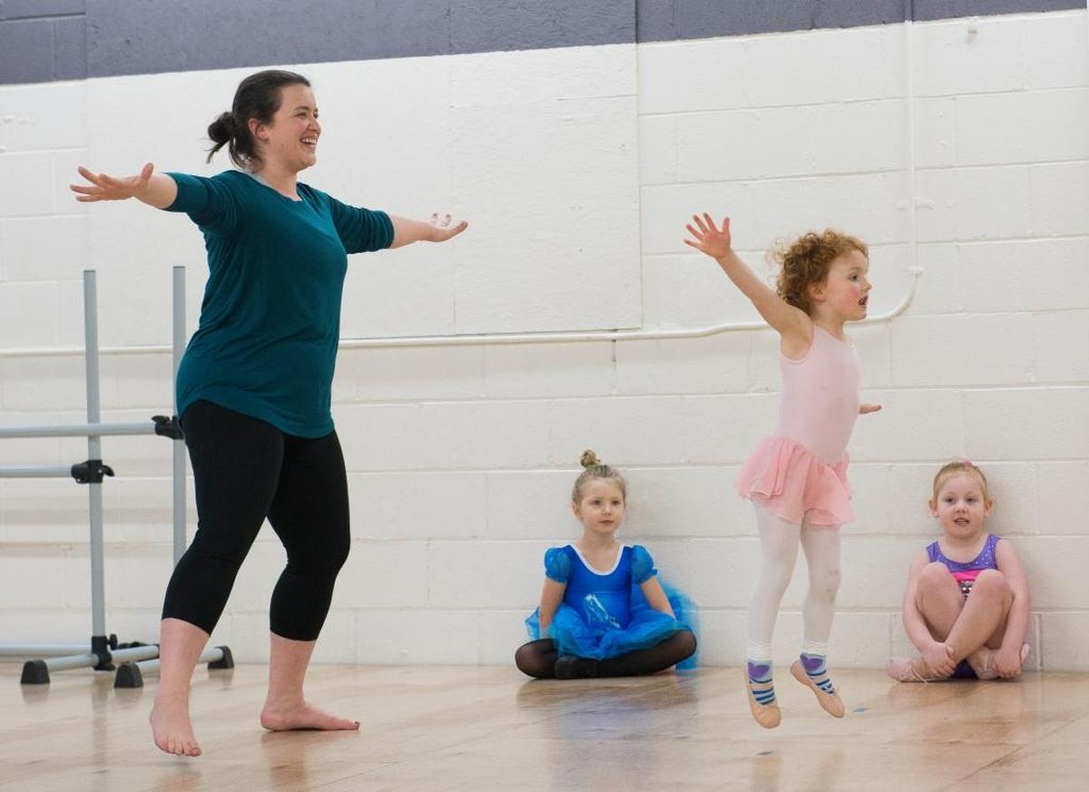Tabetha Clark, owner and director of ABCDance, leads three girls in a Pre-K Moves class on Thursday, Feb. 1, in Bellingham. ABCDance offers a variety of classes for children and adults.