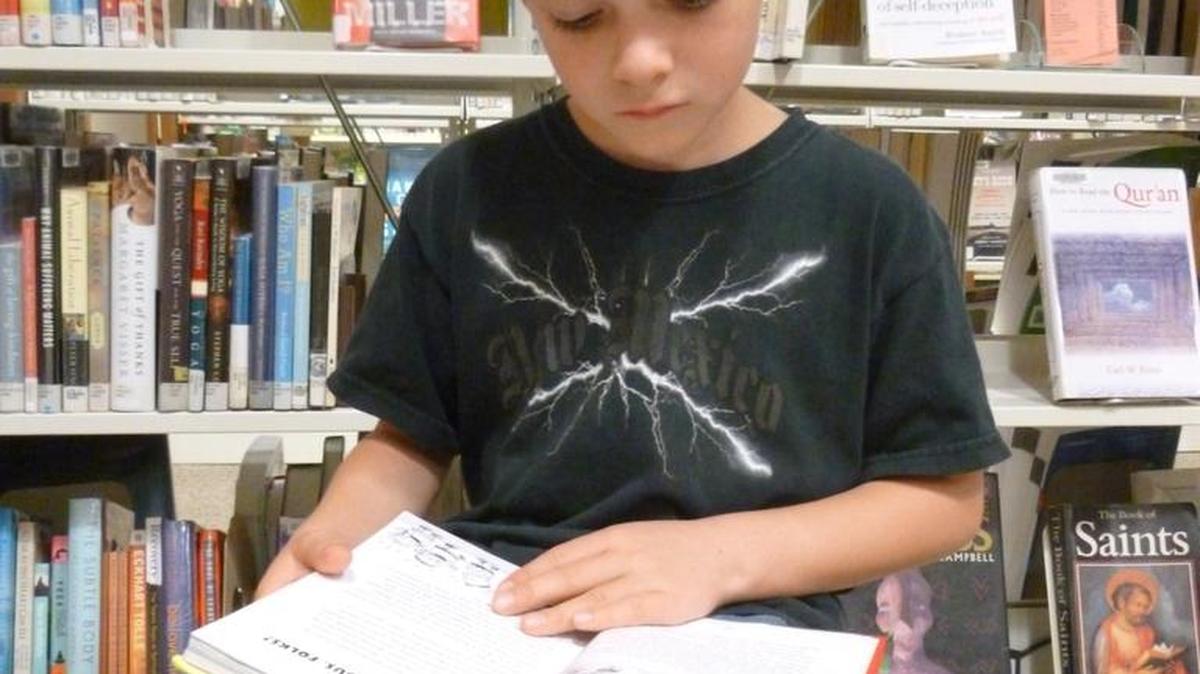 Librarians help children navigate library shelves, where thousands of new books for kids and teens are added every year.