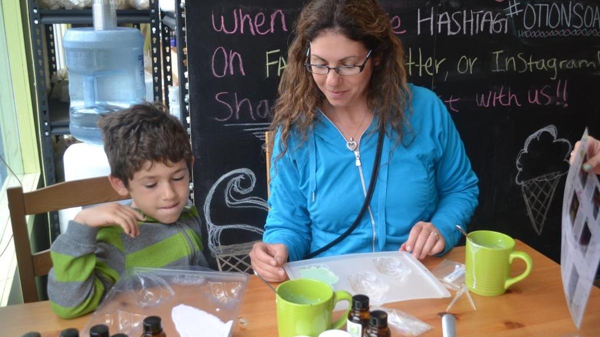Coby Ravitsky, left, and Orly Ravitsky get crafty at Otion, you can make your bar soaps, nail polishes and lip balms among other scented, practical crafts.