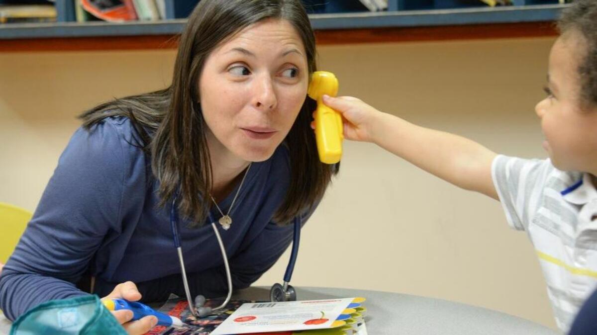 PeaceHealth Medical Group pediatrician Dr. Jordana Hawkins gets her ear checked by Toby Ssendawula, 2, Aug. 10, 2016, in the pediatric clinic on Cordata Parkway in Bellingham. (The doctor’s name was corrected Aug. 30, 2016.)