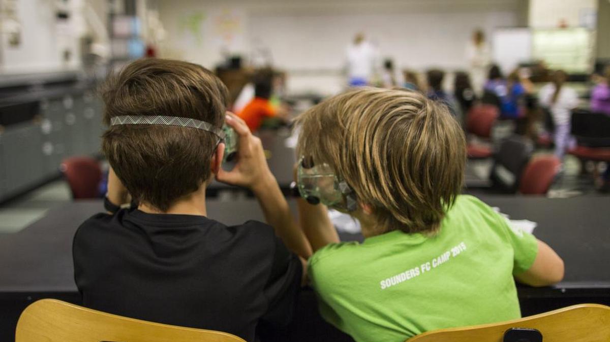 Students whisper during the 2015 Kids Night Out at Western. The university’s quarterly science-oriented event is designed to give parents a “date night” and offer a stimulating activity for their children in kindergarten through fifth grades.