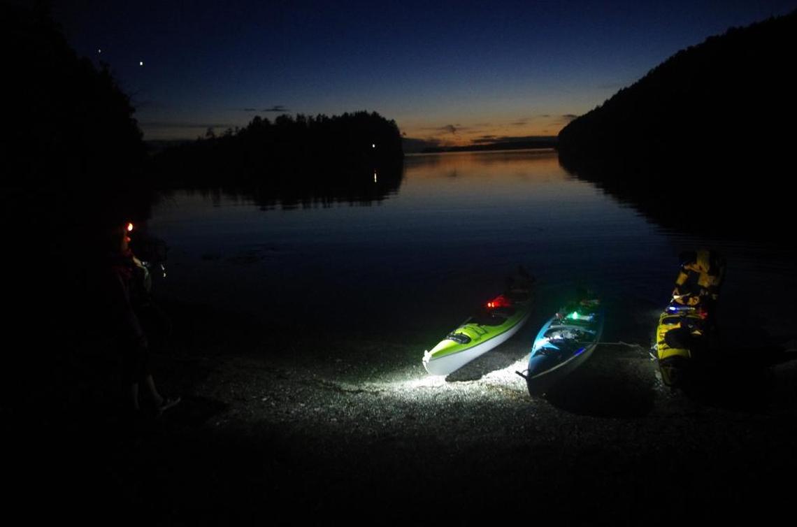 Kayakers prepare for a bioluminescence paddle on Sucia Island on the second night of a three-day trip.