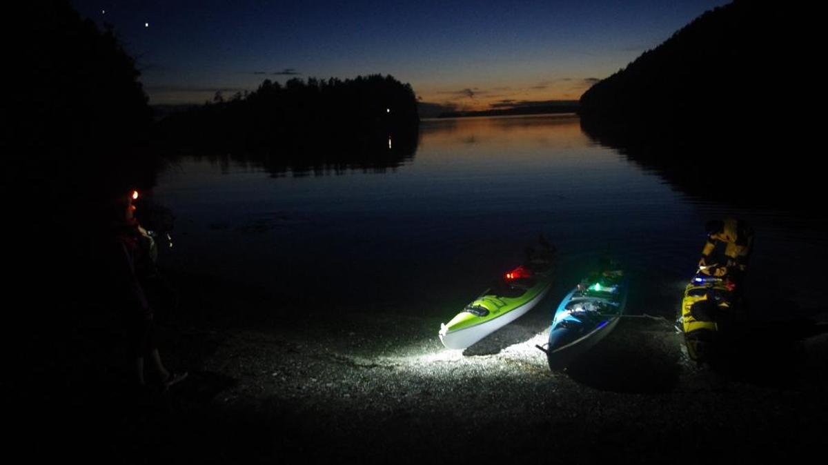 Kayakers prepare for a bioluminescence paddle on Sucia Island on the second night of a three-day trip.