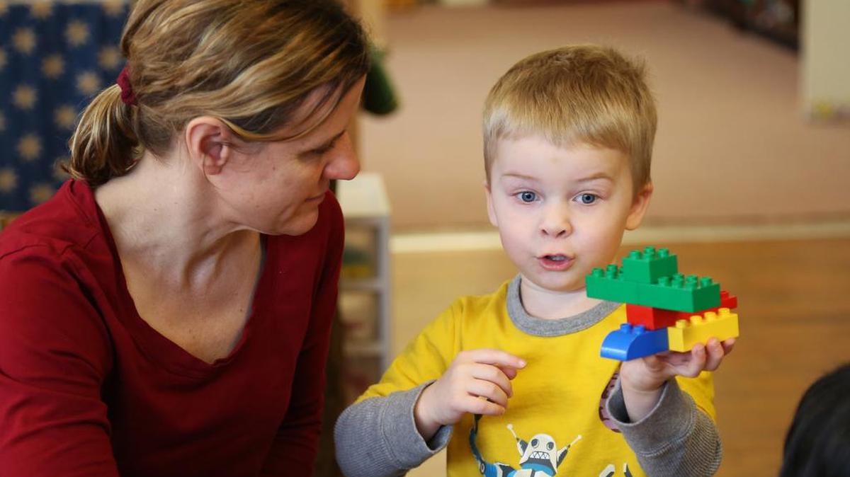 BAAY Preschool Director Tina Smiley works with a student.