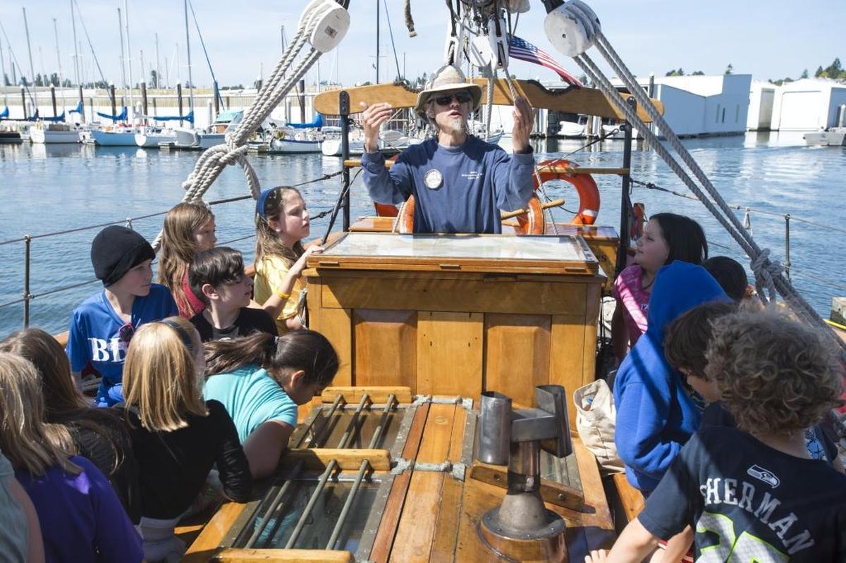 Captain Gordon Sims speaks to students from Sunnyland Elementary School before setting sail aboard the 102-year-old schooner Adventuress on Bellingham Bay. The ship is operated by the nonprofit organization Sound Experience.