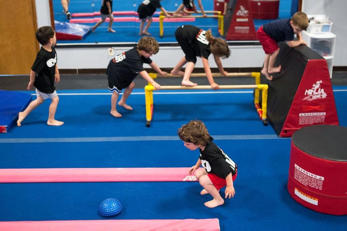 Kids run through an obstacle course during a Ninja Zone class at North Coast Gymnastics Academy on Friday, June 23, in Bellingham.