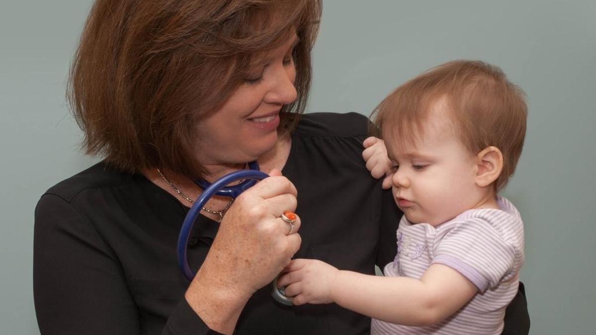 Dr. Julie Cheek with a young patient.