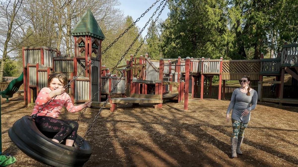 Maya, 6, gets a little help from her mother Kerie Boggess of Maple Falls on the tire swing at Million Smiles Playground at Lynden City ParkBoggess says she likes to bring her kids to the park even though it is a bit of a drive from her home.