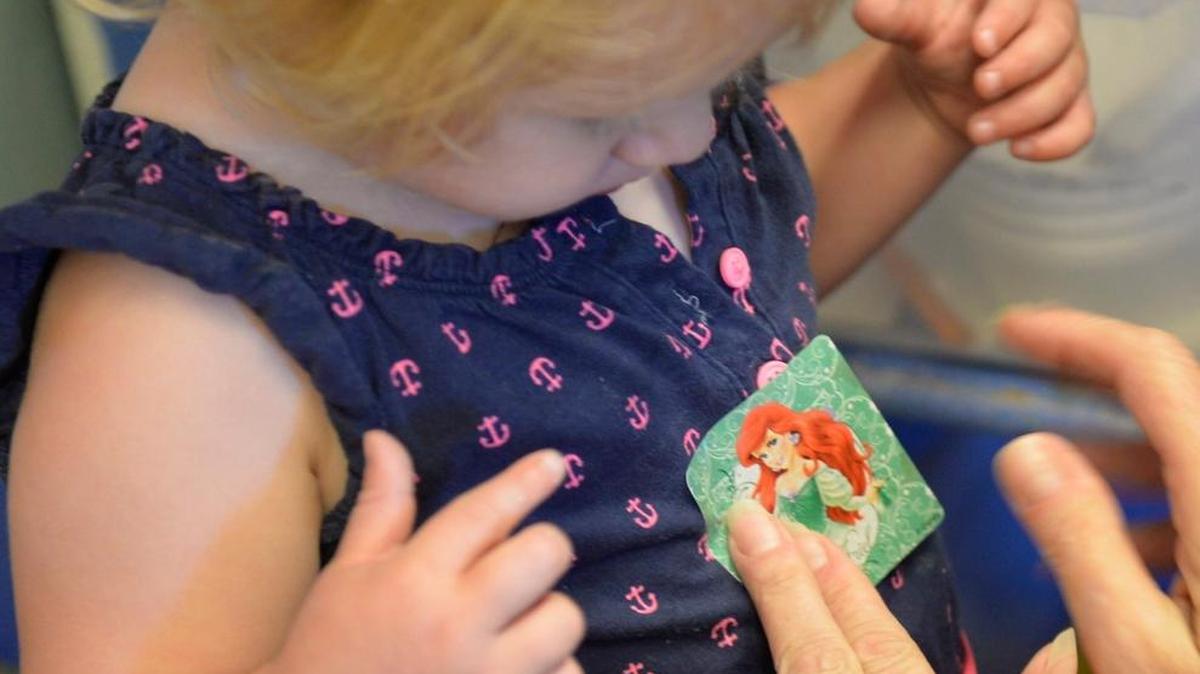 Abigail Hayes, 3, gets a sticker at Kids Korner Learning Center in Bellingham in June, 2015, after a visit from the mobile dental program offered by Interfaith, now known as Unity Care NW.