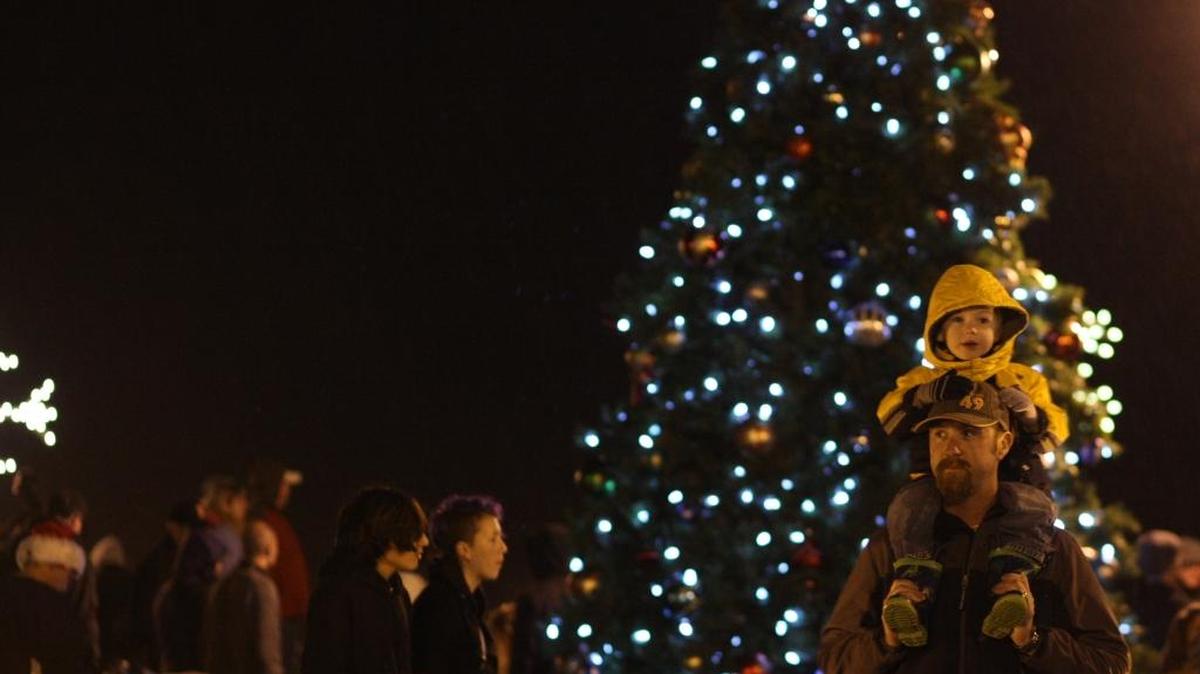 Andrew Maxey carries his son, Vincent, on top of his shoulders at Blaine’s Holiday Harbor Lights event in 2012 at the H Street Plaza in downtown Blaine. The 2016 celebration is on Dec. 3.