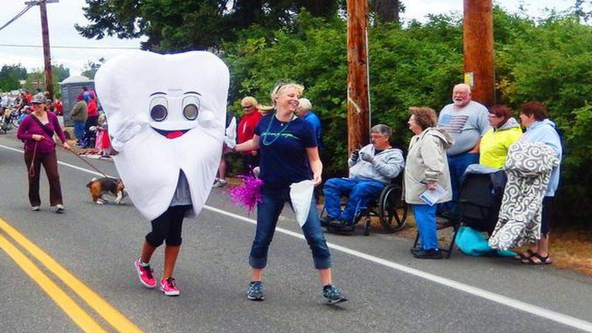 
“Toothy,” Interfaith Community Health Center’s dental mascot, marches in community parades.

