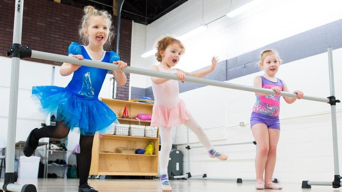 Three girls practice on a ballet barre during the Pre-K Moves class on Thursday, Feb. 1, at ABCDance in Bellingham. ABCDance offers a variety of classes for children and adults.