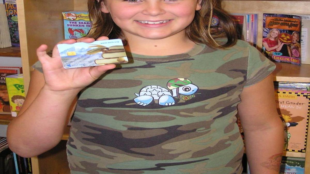 
Zoe Bedgood shows off her library card in 2007 at the Maple Falls Library, which is now known as the North Fork Community Library.
