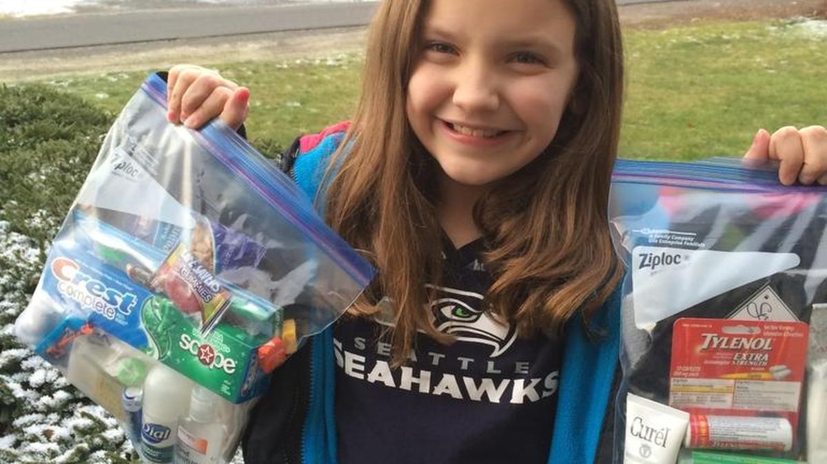 Kiarra Voigt, 8, with two of the 30 blessing bags that she made to hand out to people who are homeless.