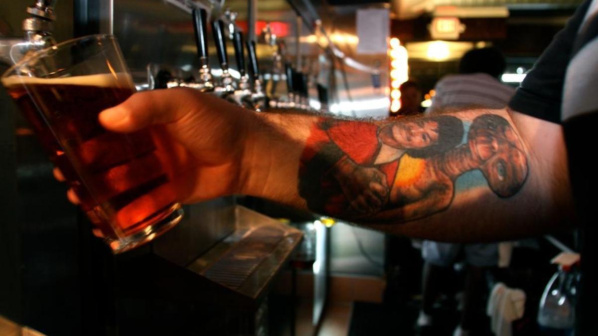 Corey Faircloth pours a beer at Spacebar, a new bar that sells 22 craft beers on tap in Falls Church, Virginia.