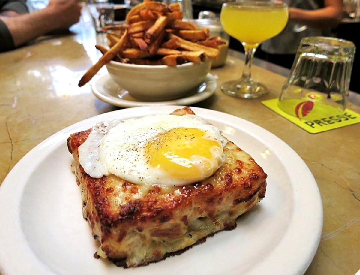 A lunch offering at Café Presse: Ostensibly a ham-and-cheese sandwich, admittedly one slathered in bechamel and kissed under a broiler – becomes something that stops time. To really gild the lily, put an egg on it and make your Croque Madame, pictured.