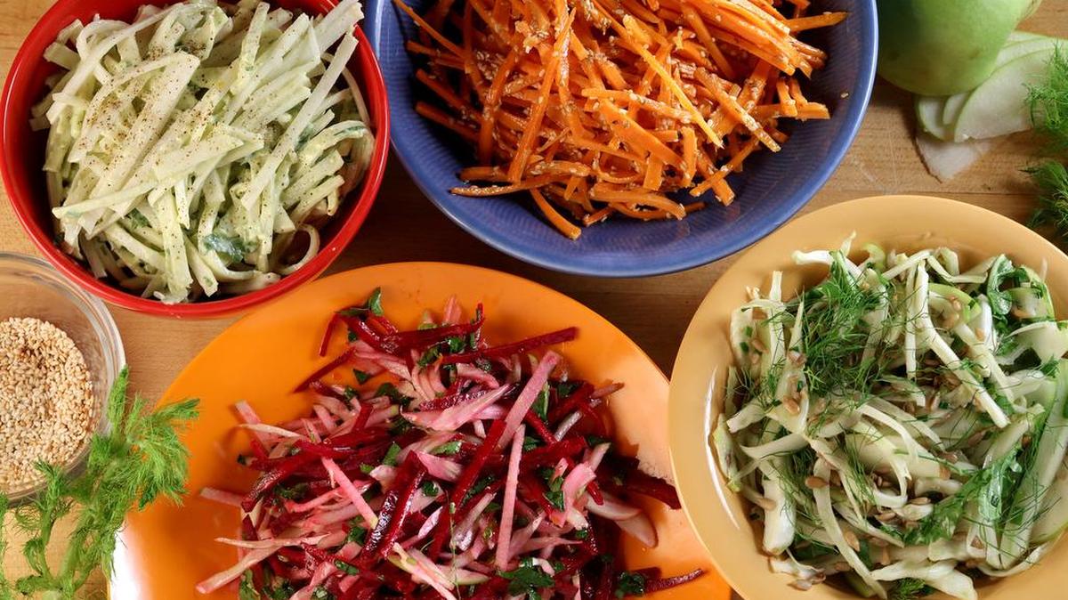 
Kohlrabi slaw with creamy avocado, top left and clockwise, carrot slaw with miso vinegarette, shaved fennel with arugula crunch salad, and raw beet salad with fennel.

