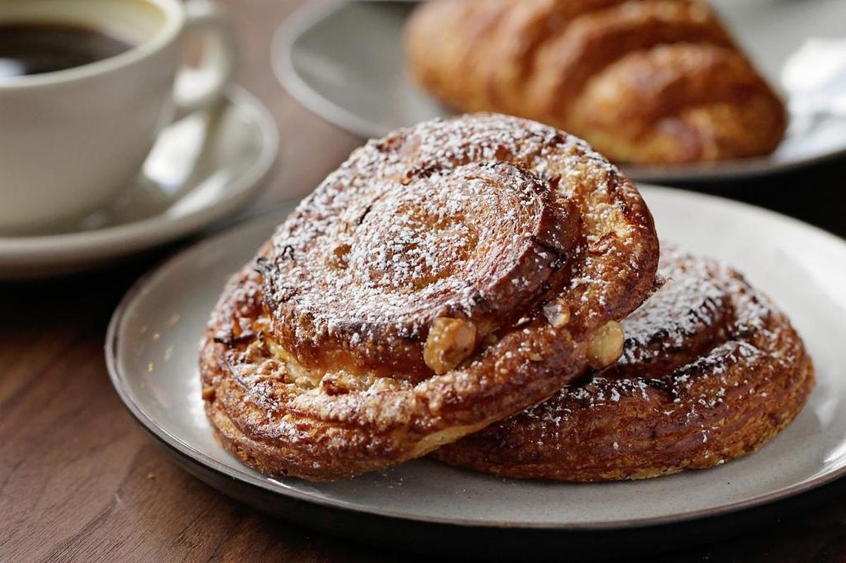 On the menu for breakfast: Savory brioches and all manner of sweet things swaddled in croissant dough including the orange hazelnut pinwheel, pictured, at Macrina Bakery in Seattle.
