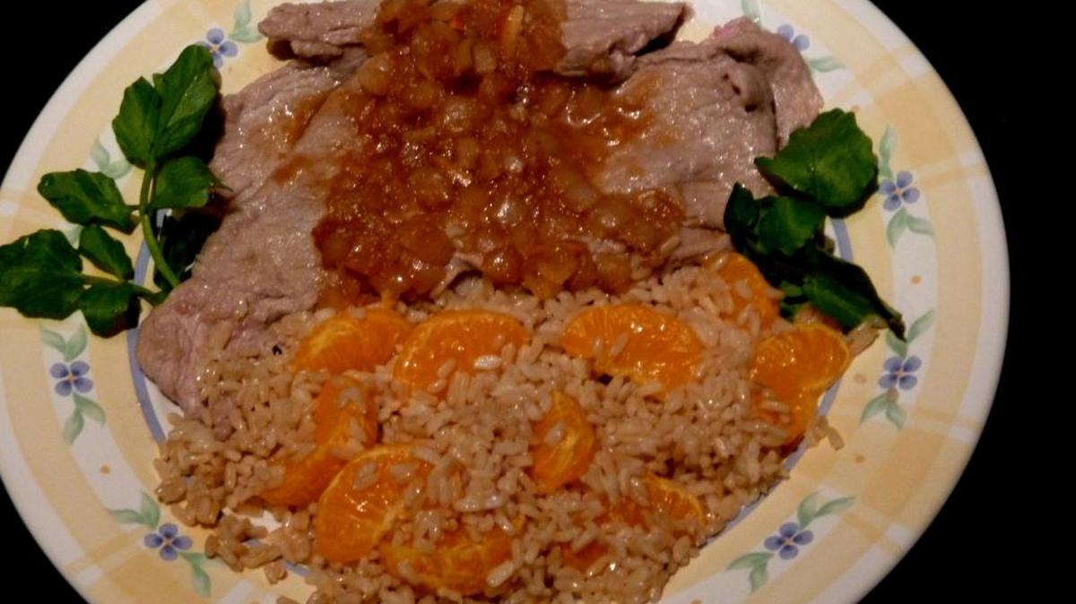 Veal Cutlets in Madeira Sauce with Orange Rice.