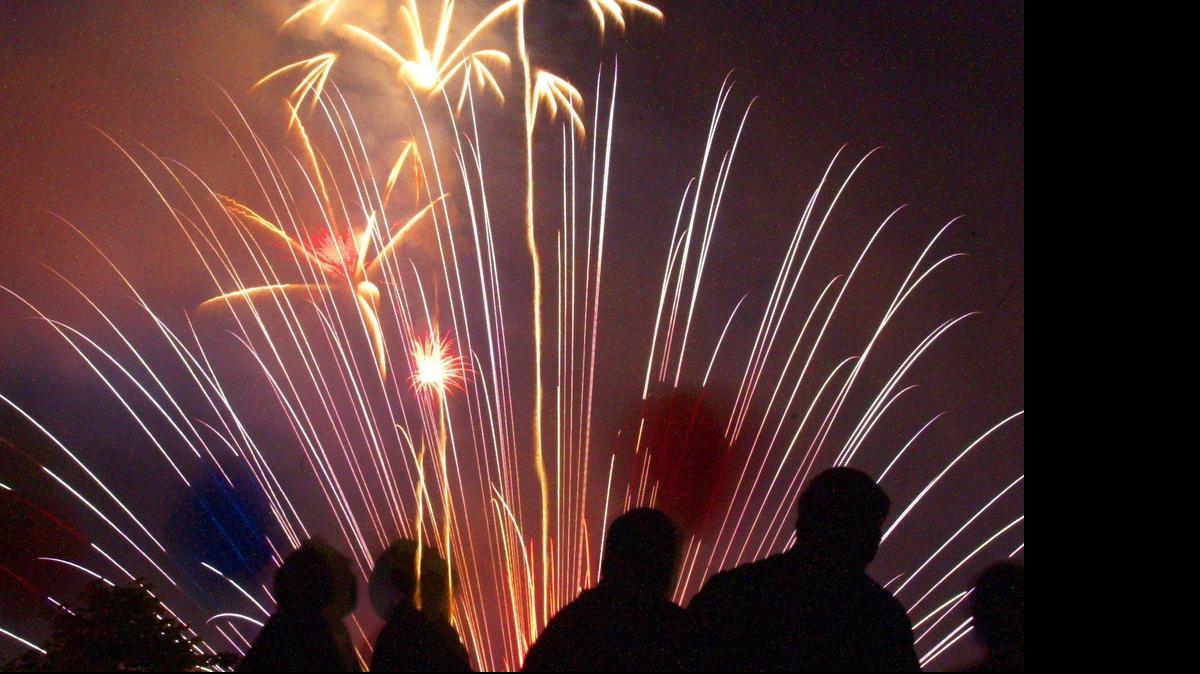 
Spectators watch the fireworks in Bellingham from the top of a parking garage in downtown. 
