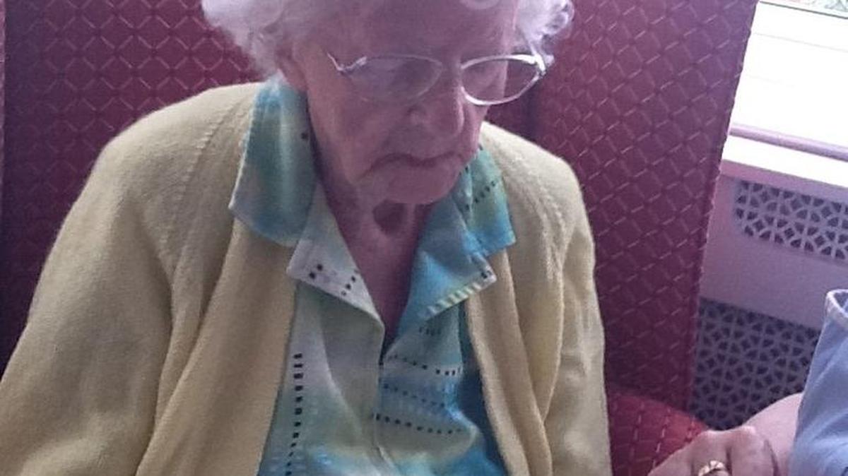 In a handout photo, Dorothy Peel, 108, of London, signs the consent form to participate in the supercentenarian study. James Clement, a professed citizen-scientist, has scoured the globe for supercentenarians, aged 110 and older, willing to contribute their genomes to a rare scientific cache.