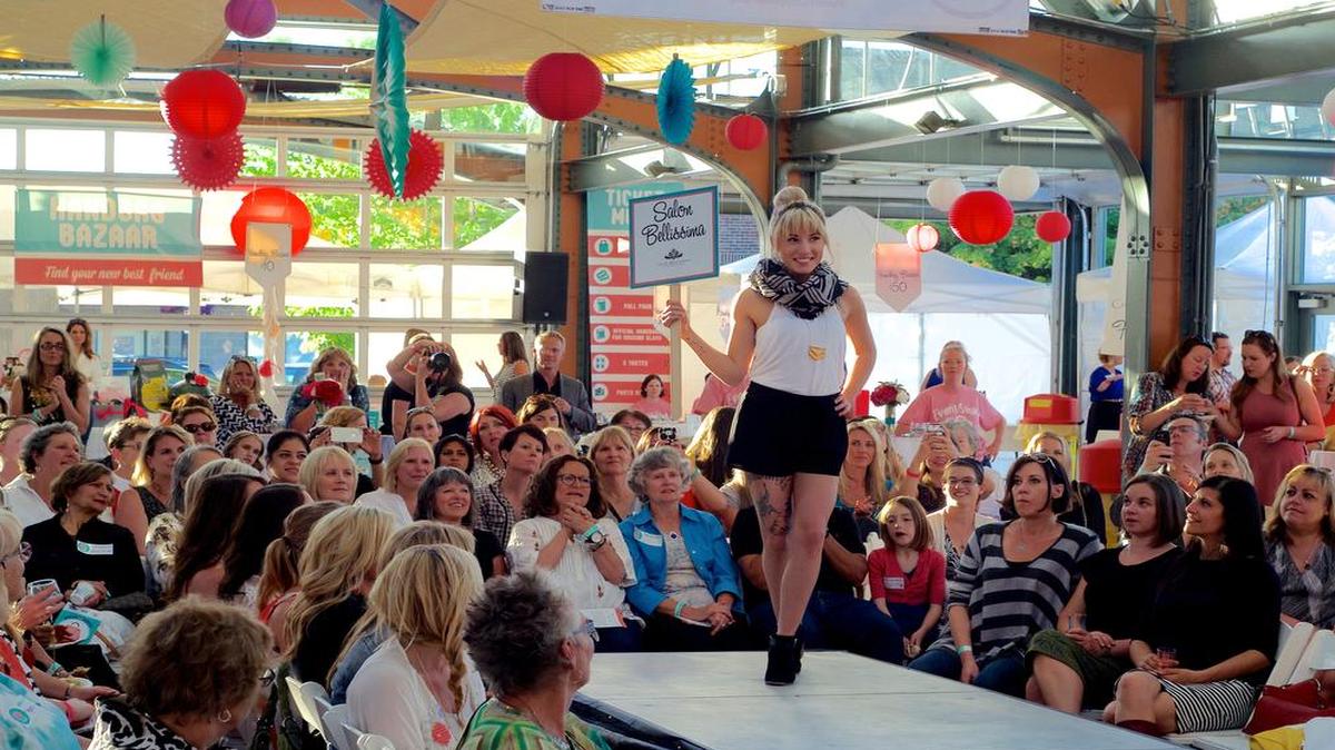 
Angela Jones walks the runway modeling for Salon Bellissima during the “Handbags for Housing” fundraiser for Lydia Place June 4 at Depot Market Square.
