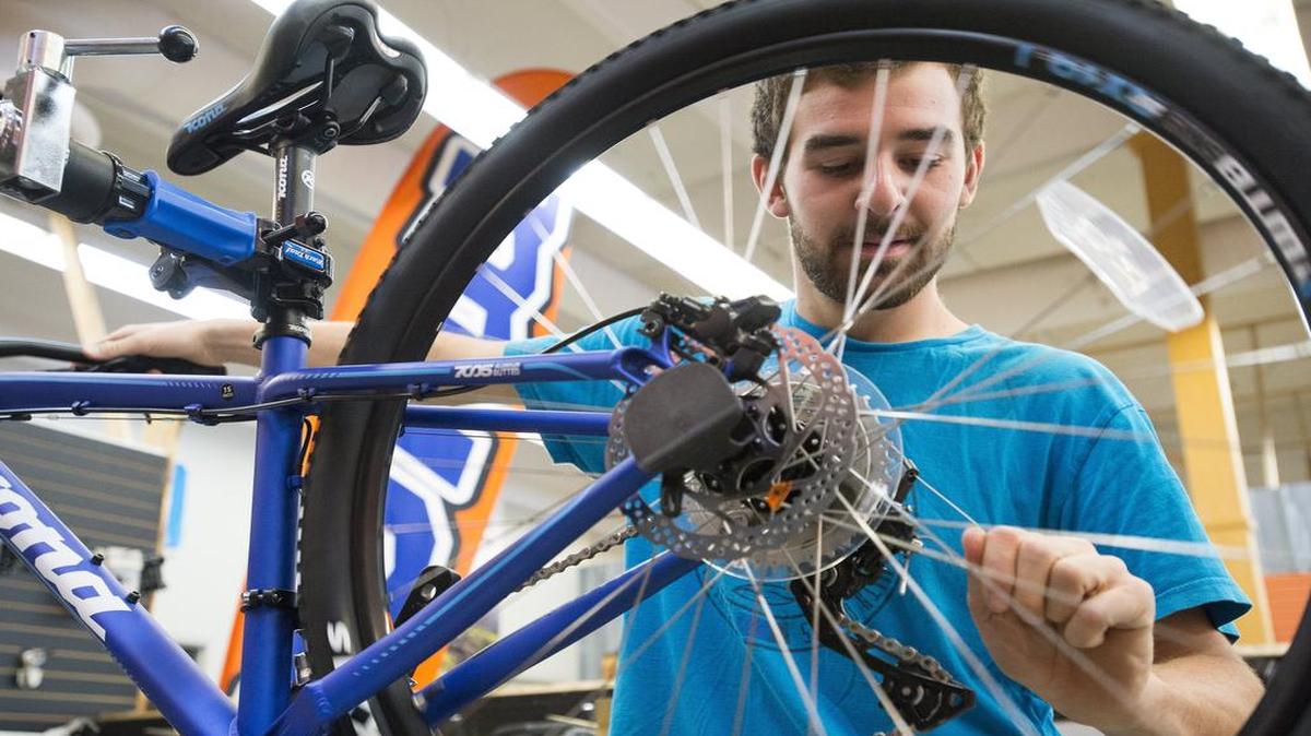 
Mark Allison prepares a new bicycle for the showroom floor in June 2015 at The Kona Bike Shop, on North State Street, Bellingham.
