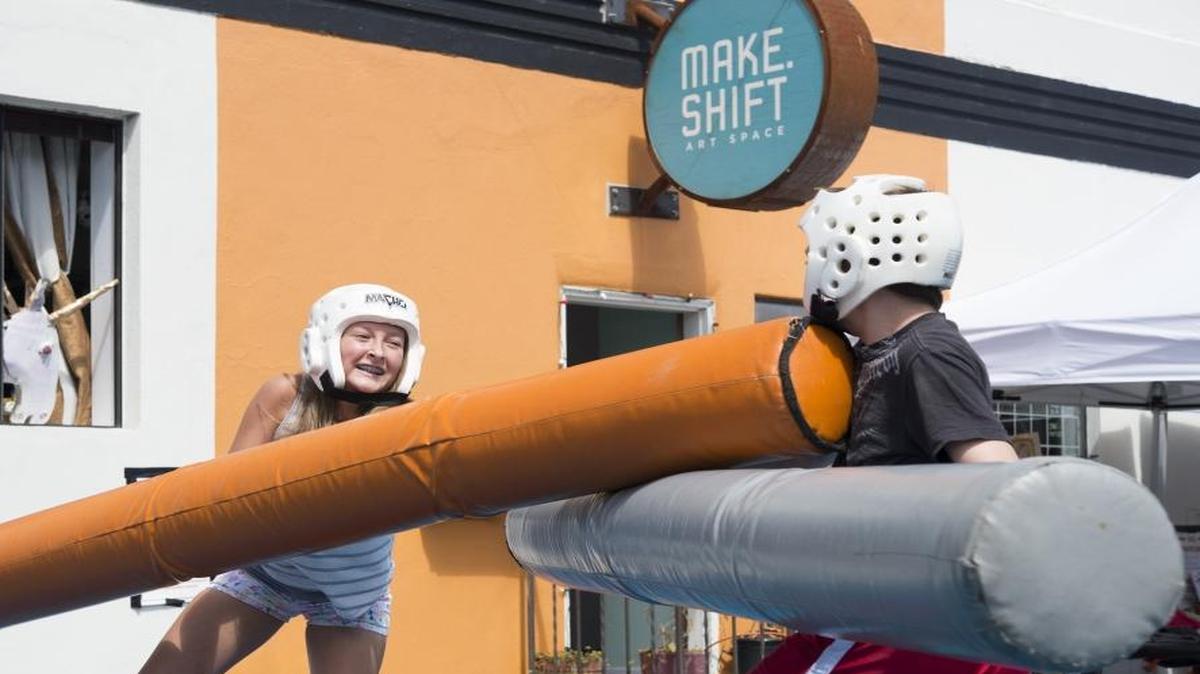 Sierra Hoseid battles Asa Danforth in a friendly jousting competition at the Make.Shift Block Party in downtown Bellingham in August 2015.