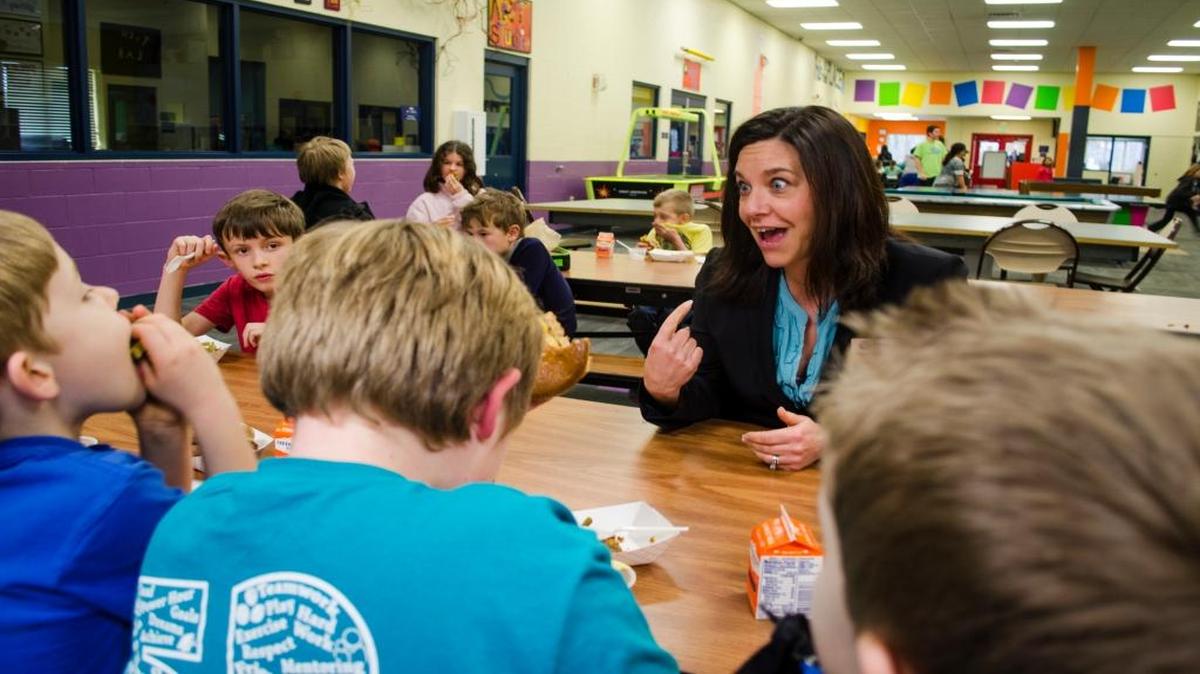 Heather Powell, the executive director of Boys & Girls Clubs of Whatcom County, jokes with kids over veggie burgers during the after-school program at the Bellingham club on Feb. 27, 2016.
