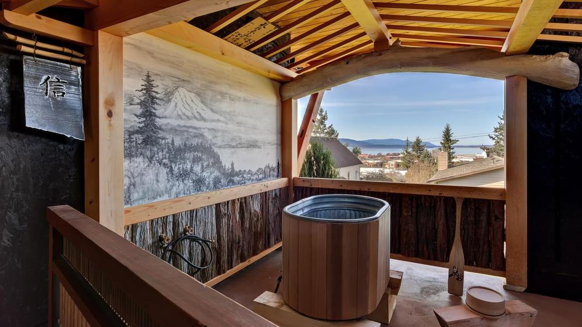 
A galvanized farm water tank serves as an outdoor soaking tub at Ross Grier’s house in Fairhaven. Grier grew up in Japan, where a wooden soaking tub called an “ofuro” is a traditional home feature.
