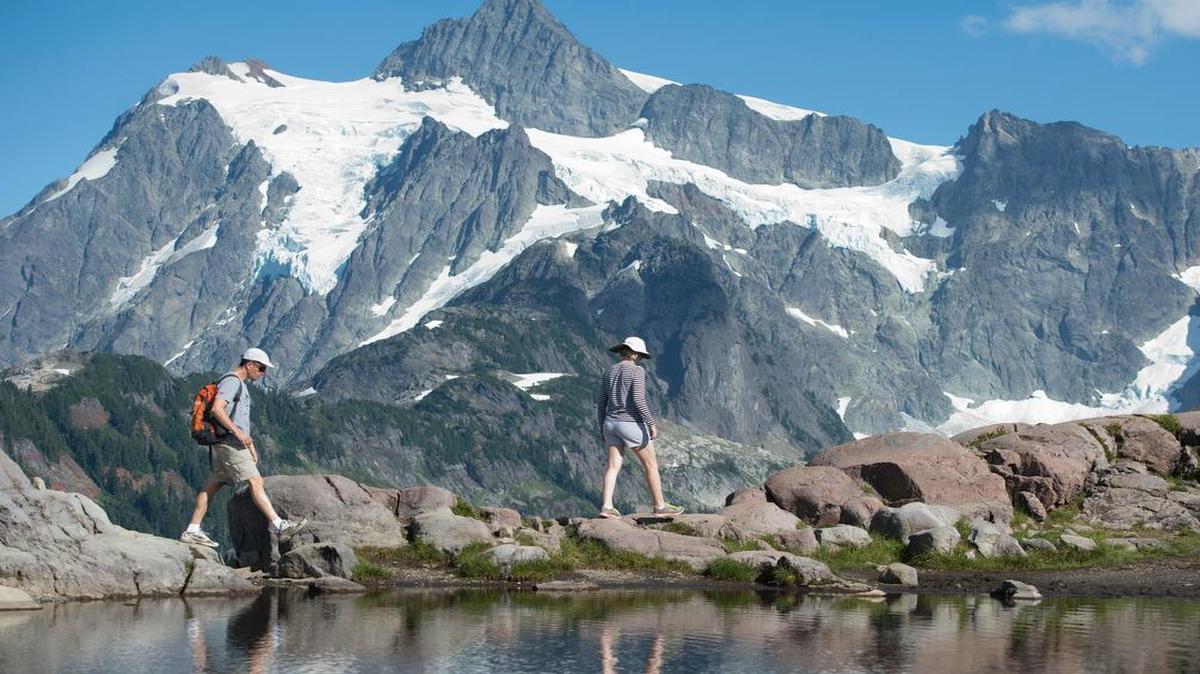 
Jim Bryan, left, walks with his wife, Jenny Bryan, along the Artist Ridge Trail in August 2014. The trail is by Artist Point, a popular destination for people enjoying alpine country in Whatcom County.
