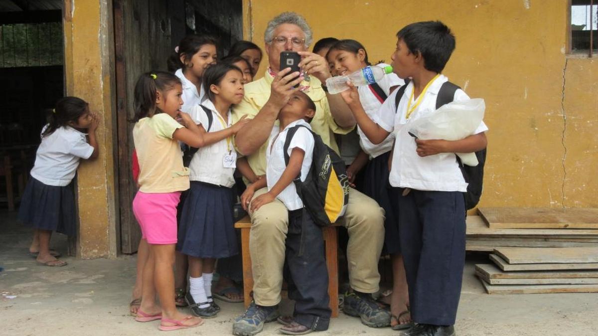 Bellingham Bay Rotary Club member Bill Gorman enjoys a break with students in Honduras in July 2015. Gorman and six other people traveled there to build classroom space for kindergarteners.