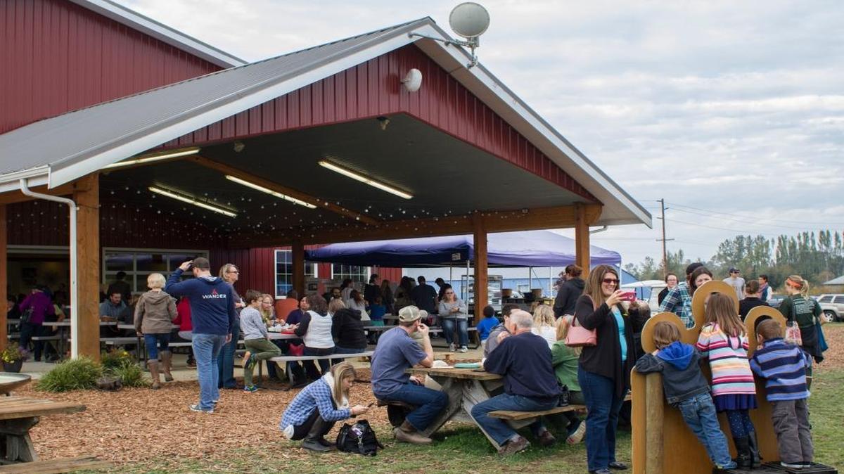 Customers sit outside with their food and enjoy the weather Saturday, Oct. 17, 2015, at BelleWood Acres.