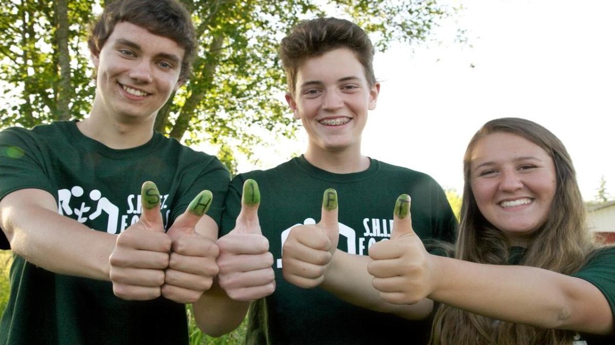 Ferndale High School students Ryan England, left, Kevin Rietveld, and Elizabeth Hand are the original members of S.H.I.F.T., a student-run effort to raise food and money for Ferndale Food Bank.